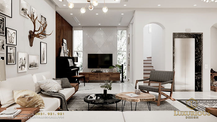 Phòng khách hiện đại sang trọng với tone màu trắng kết hợp bộ bàn ghế sofa gỗ tinh tế